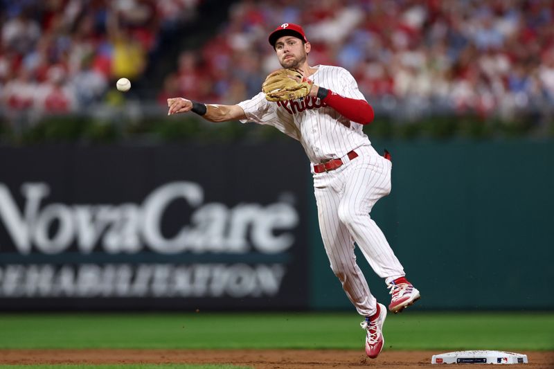 Oct 3, 2023; Philadelphia, Pennsylvania, USA; Philadelphia Phillies shortstop Trea Turner (7) makes a throw to first base to get the out against the Miami Marlins in the second inning during game one of the Wildcard series for the 2023 MLB playoffs at Citizens Bank Park. Mandatory Credit: Bill Streicher-USA TODAY Sports