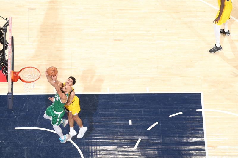 INDIANAPOLIS, IN - MAY 25: Derrick White #9 of the Boston Celtics drives to the basket during the game against the Indiana Pacers during Game 3 of the Eastern Conference Finals of the 2024 NBA Playoffs on May 25, 2024 at Gainbridge Fieldhouse in Indianapolis, Indiana. NOTE TO USER: User expressly acknowledges and agrees that, by downloading and or using this Photograph, user is consenting to the terms and conditions of the Getty Images License Agreement. Mandatory Copyright Notice: Copyright 2024 NBAE (Photo by Nathaniel S. Butler/NBAE via Getty Images)