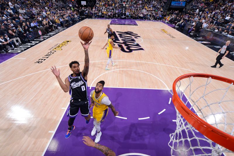 SACRAMENTO, CA - MARCH 13:  Malik Monk #0 of the Sacramento Kings drives to the basket during the game against the Los Angeles Lakers on March 13, 2024 at Golden 1 Center in Sacramento, California. NOTE TO USER: User expressly acknowledges and agrees that, by downloading and or using this Photograph, user is consenting to the terms and conditions of the Getty Images License Agreement. Mandatory Copyright Notice: Copyright 2024 NBAE (Photo by Rocky Widner/NBAE via Getty Images)