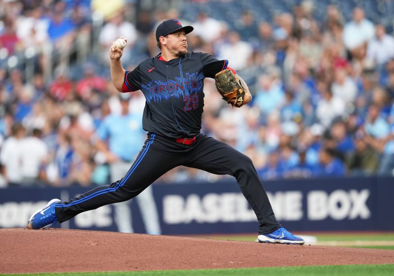 Jul 24, 2024; Toronto, Ontario, CAN; Toronto Blue Jays starting pitcher Yariel Rodriguez (29) throws a pitch against the Tampa Bay Rays during the first inning at Rogers Centre. Mandatory Credit: Nick Turchiaro-USA TODAY Sports