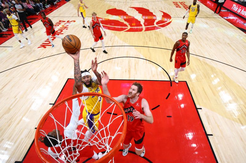 TORONTO, CANADA - NOVEMBER 1: Anthony Davis #3 of the Los Angeles Lakers shoots the ball during the game against the Toronto Raptors on November 1, 2024 at the Scotiabank Arena in Toronto, Ontario, Canada.  NOTE TO USER: User expressly acknowledges and agrees that, by downloading and or using this Photograph, user is consenting to the terms and conditions of the Getty Images License Agreement.  Mandatory Copyright Notice: Copyright 2024 NBAE (Photo by Vaughn Ridley/NBAE via Getty Images)