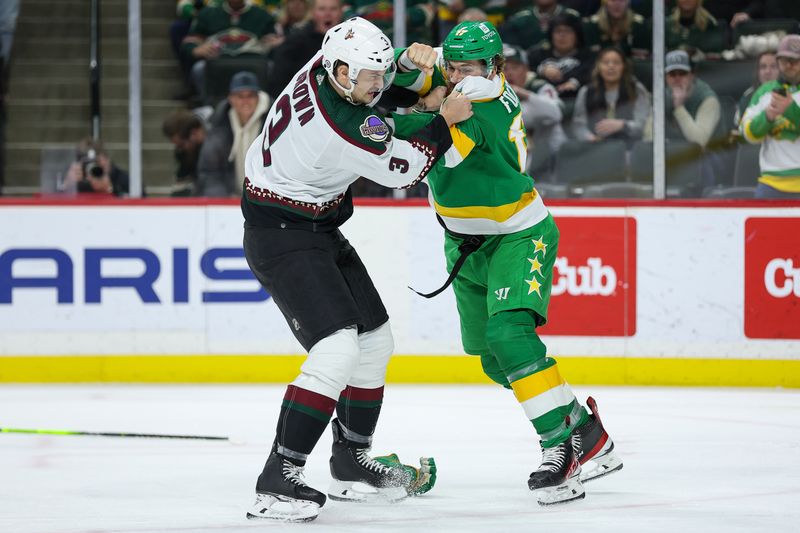 Jan 13, 2024; Saint Paul, Minnesota, USA; Minnesota Wild left wing Marcus Foligno (17) and Arizona Coyotes defenseman Josh Brown (3) fight during the third period at Xcel Energy Center. Mandatory Credit: Matt Krohn-USA TODAY Sports