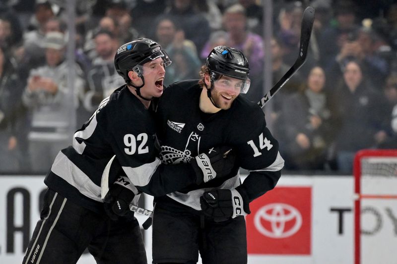 Dec 27, 2025; Los Angeles, California, USA;  Los Angeles Kings right wing Alex Laferriere (14) is congratulated by Los Angeles Kings defenseman Brandt Clarke (92) after scoring his first career hat trick in the third period against the Anaheim Ducks at Crypto.com Arena. Mandatory Credit: Jayne Kamin-Oncea-Imagn Images
