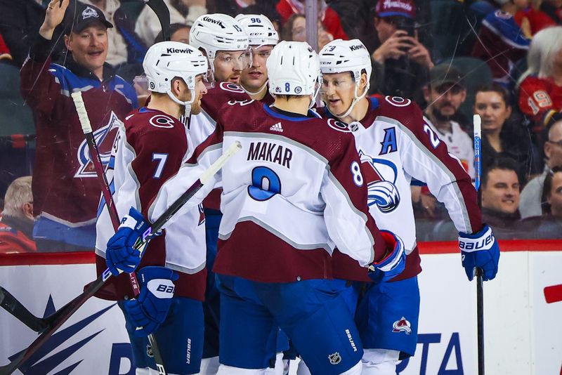 Mar 12, 2024; Calgary, Alberta, CAN; Colorado Avalanche right wing Valeri Nichushkin (13) celebrates his goal with teammates against the Calgary Flames during the second period at Scotiabank Saddledome. Mandatory Credit: Sergei Belski-USA TODAY Sports