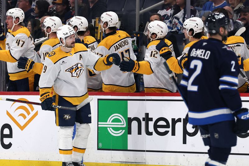 Jan 7, 2025; Winnipeg, Manitoba, CAN; Nashville Predators left wing Filip Forsberg (9) celebrates his second period goal against the Winnipeg Jets at Canada Life Centre. Mandatory Credit: James Carey Lauder-Imagn Images