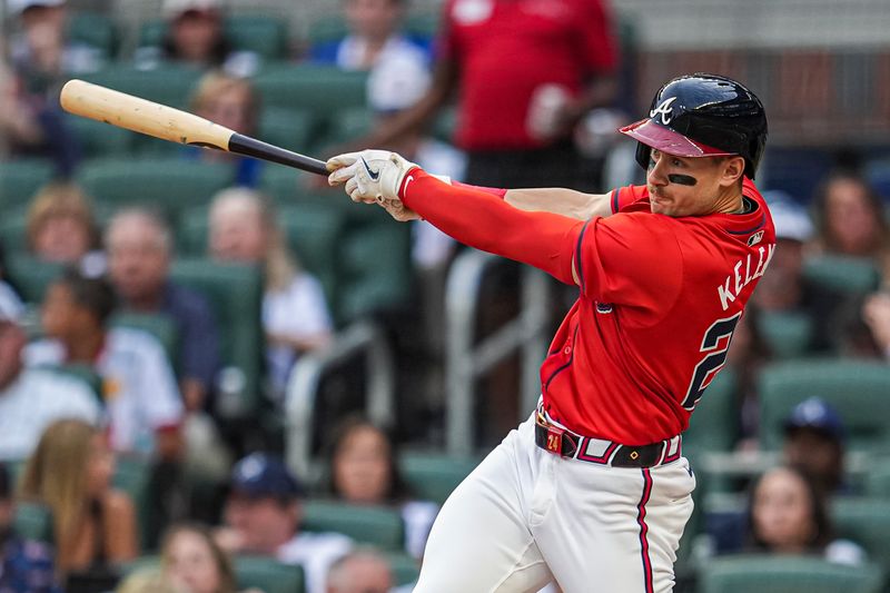 May 31, 2024; Cumberland, Georgia, USA; Atlanta Braves left fielder Jarred Kelenic (24) hits a double to drive in two runs against the Oakland Athletics during the second inning at Truist Park. Mandatory Credit: Dale Zanine-USA TODAY Sports