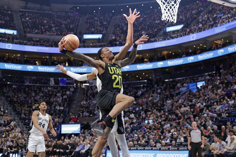 SALT LAKE CITY, UT - MARCH 27: Victor Wembanyama #1 of the San Antonio Spurs blocks John Collins #20 of the Utah Jazz during the game on March 27, 2024 at Delta Center in Salt Lake City, Utah. NOTE TO USER: User expressly acknowledges and agrees that, by downloading and or using this Photograph, User is consenting to the terms and conditions of the Getty Images License Agreement. Mandatory Copyright Notice: Copyright 2024 NBAE (Photo by Chris Nicoll/NBAE via Getty Images)