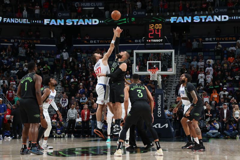 NEW ORLEANS, LA - MARCH 15: Ivica Zubac #40 of the LA Clippers and Jonas Valanciunas #17 of the New Orleans Pelicans go up for the opening tip off on March 15, 2024 at the Smoothie King Center in New Orleans, Louisiana. NOTE TO USER: User expressly acknowledges and agrees that, by downloading and or using this Photograph, user is consenting to the terms and conditions of the Getty Images License Agreement. Mandatory Copyright Notice: Copyright 2024 NBAE (Photo by Layne Murdoch Jr./NBAE via Getty Images)