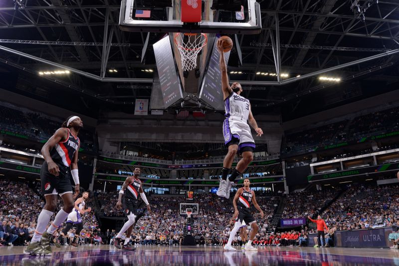 SACRAMENTO, CA - OCTOBER 13: Jordan McLaughlin #3 of the Sacramento Kings drives to the basket during the game against the Portland Trail Blazers during a NBA preseason game on October 13, 2024 at Golden 1 Center in Sacramento, California. NOTE TO USER: User expressly acknowledges and agrees that, by downloading and or using this Photograph, user is consenting to the terms and conditions of the Getty Images License Agreement. Mandatory Copyright Notice: Copyright 2024 NBAE (Photo by Rocky Widner/NBAE via Getty Images)