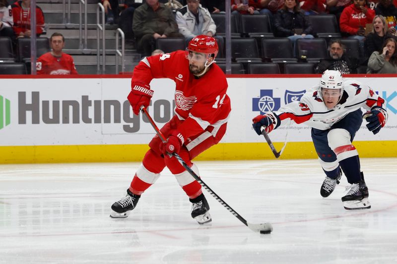 Apr 9, 2024; Detroit, Michigan, USA;  Detroit Red Wings center Dylan Larkin (71) takes a shot in the second period against the Washington Capitals at Little Caesars Arena. Mandatory Credit: Rick Osentoski-USA TODAY Sports