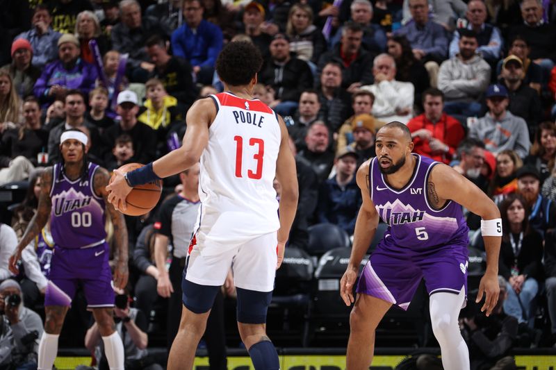 SALT LAKE CITY, UT - MARCH 4:  Talen Horton-Tucker #5 of the Utah Jazz plays defense against Jordan Poole #13 of the Washington Wizards on March 4, 2024 at vivint.SmartHome Arena in Salt Lake City, Utah. NOTE TO USER: User expressly acknowledges and agrees that, by downloading and or using this Photograph, User is consenting to the terms and conditions of the Getty Images License Agreement. Mandatory Copyright Notice: Copyright 2024 NBAE (Photo by Melissa Majchrzak/NBAE via Getty Images)