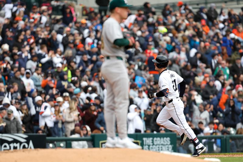 Apr 5, 2024; Detroit, Michigan, USA;  Detroit Tigers designated hitter Mark Canha (21) runs the bases after hitting a home run in the sixth inning against the Oakland Athletics at Comerica Park. Mandatory Credit: Rick Osentoski-USA TODAY Sports