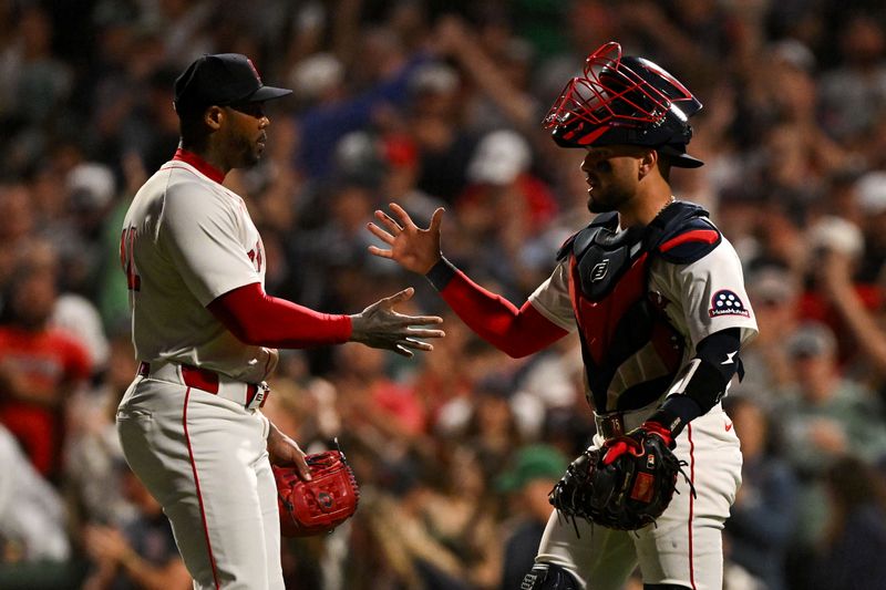 Sep 14, 2025; Boston, Massachusetts, USA; Boston Red Sox relief pitcher Aroldis Chapman (44) high-fives catcher Carlos Narvaez (75) after a game against the New York Yankees at Fenway Park. Mandatory Credit: Brian Fluharty-Imagn Images