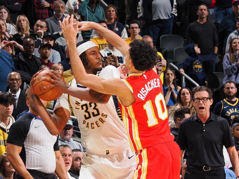 INDIANAPOLIS, IN - FEBRUARY 1: Myles Turner #33 of the Indiana Pacers looks to pass the ball during the game against the Atlanta Hawks on February 1, 2025 at Gainbridge Fieldhouse in Indianapolis, Indiana. NOTE TO USER: User expressly acknowledges and agrees that, by downloading and or using this Photograph, user is consenting to the terms and conditions of the Getty Images License Agreement. Mandatory Copyright Notice: Copyright 2025 NBAE (Photo by Ron Hoskins/NBAE via Getty Images)