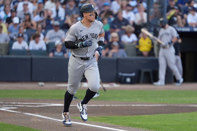 Apr 18, 2025; Tampa, Florida, USA; New York Yankees outfielder Aaron Judge (99) runs to first base after being walked by the Tampa Bay Rays during the first inning at George M. Steinbrenner Field. Mandatory Credit: Dave Nelson-Imagn Images