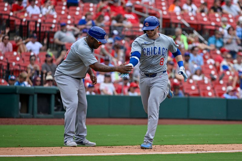 Jul 14, 2024; St. Louis, Missouri, USA;  Chicago Cubs left fielder Ian Happ (8) is congratulated by third base coach Willie Harris (33) after hitting a solo home run against the St. Louis Cardinals during the eighth inning at Busch Stadium. Mandatory Credit: Jeff Curry-USA TODAY Sports