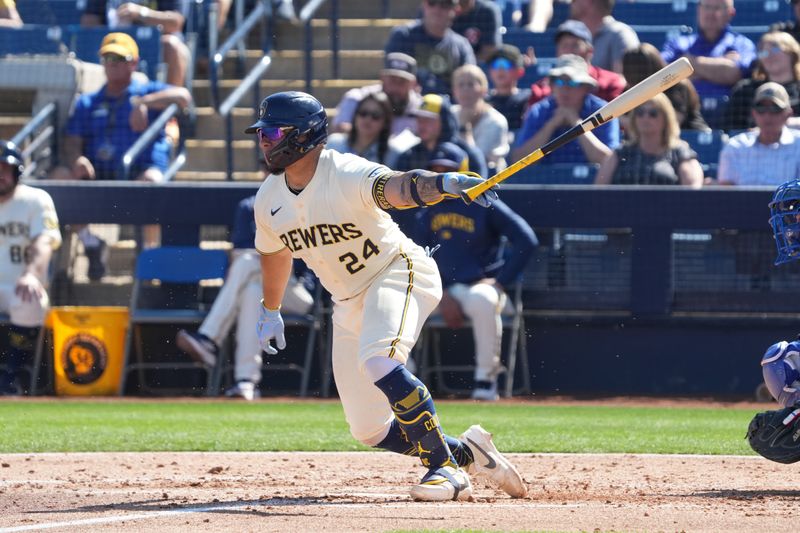 Feb 26, 2025; Phoenix, Arizona, USA; Milwaukee Brewers catcher William Contreras (24) hits against the Los Angeles Dodgers during the third inning at American Family Fields of Phoenix. Mandatory Credit: Rick Scuteri-Imagn Images