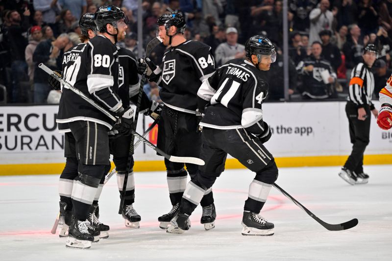 Apr 11, 2024; Los Angeles, California, USA; Los Angeles Kings center Akil Thomas (41) heads back to the bench after scoring a goal in the second period against the Calgary Flames at Crypto.com Arena. Mandatory Credit: Jayne Kamin-Oncea-USA TODAY Sports