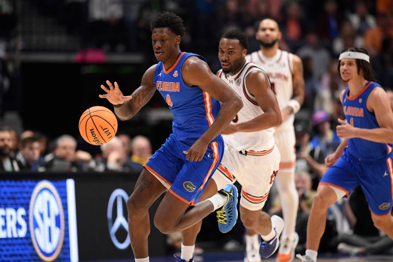 Mar 17, 2024; Nashville, TN, USA; Florida Gators forward Tyrese Samuel (4) controls the ball in the first half against the Auburn Tigers in the SEC Tournament championship game at Bridgestone Arena. Mandatory Credit: Steve Roberts-USA TODAY Sports