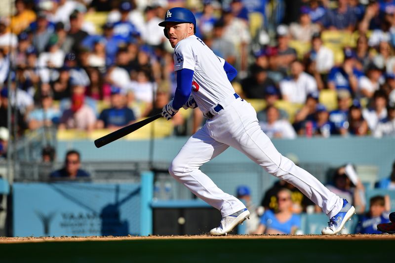 Jun 25, 2023; Los Angeles, California, USA; Los Angeles Dodgers first baseman Freddie Freeman (5) hits a double against the Houston Astros during the sixth inning at Dodger Stadium. Mandatory Credit: Gary A. Vasquez-USA TODAY Sports