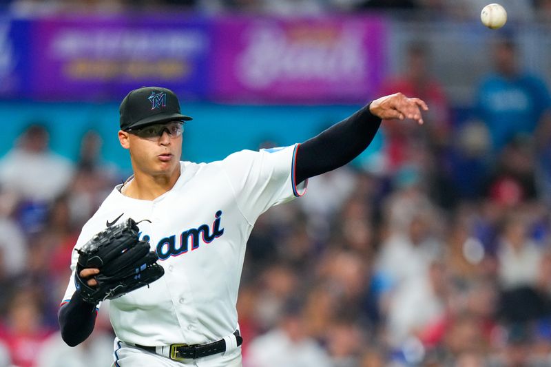 Sep 17, 2023; Miami, Florida, USA; Miami Marlins starting pitcher Jesus Luzardo (44) throws the ball to first base for an out against the Atlanta Braves during the fifth inning at loanDepot Park. Mandatory Credit: Rich Storry-USA TODAY Sports