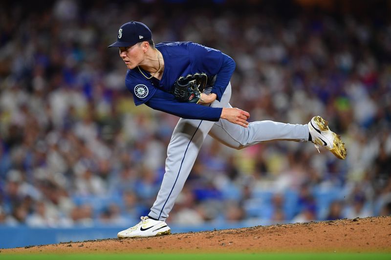 Aug 19, 2024; Los Angeles, California, USA; Seattle Mariners pitcher Bryan Woo (22) throws against the Los Angeles Dodgers during the sixth inning at Dodger Stadium. Mandatory Credit: Gary A. Vasquez-USA TODAY Sports