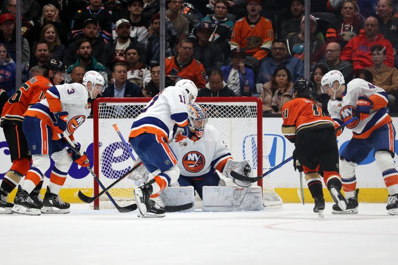 Mar 15, 2023; Anaheim, California, USA; New York Islanders goaltender Ilya Sorokin (30) protects the goal from Anaheim Ducks center Trevor Zegras (11) during the second period at Honda Center. Mandatory Credit: Kiyoshi Mio-USA TODAY Sports