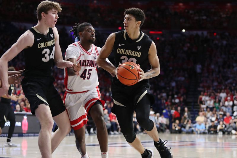 Feb 18, 2023; Tucson, Arizona, USA; Colorado Buffaloes guard Nique Clifford (32) drives to the net with center Lawson Lovering (34) against Arizona Wildcats guard Cedric Henderson Jr. (45)  during the first half at McKale Center. Mandatory Credit: Zachary BonDurant-USA TODAY Sports