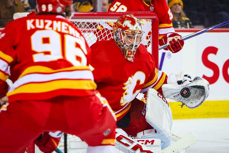 Feb 22, 2024; Calgary, Alberta, CAN; Calgary Flames goaltender Jacob Markstrom (25) makes a save against the Boston Bruins during the third period at Scotiabank Saddledome. Mandatory Credit: Sergei Belski-USA TODAY Sports