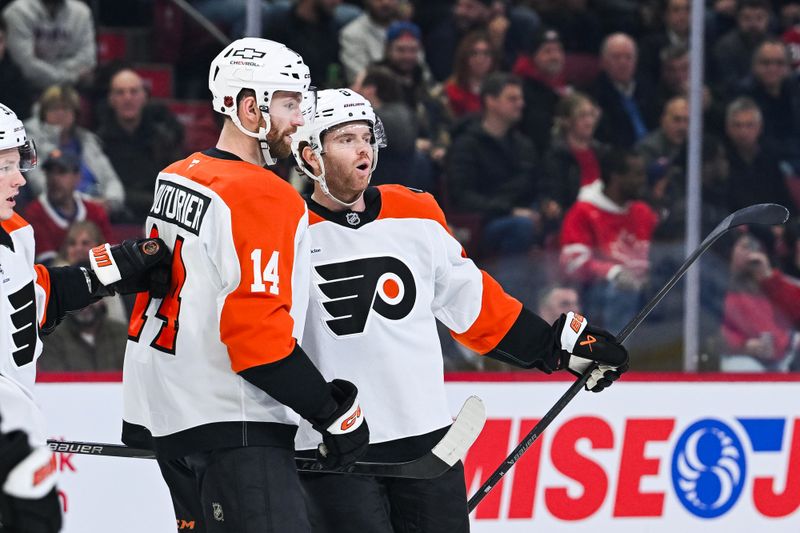 Nov 4, 2025; Montreal, Quebec, CAN; Philadelphia Flyers defenseman Cam York (8) celebrates his first goal of the game against the Montreal Canadiens with Philadelphia Flyers center Sean Couturier (14) during the first period at Bell Centre. Mandatory Credit: David Kirouac-Imagn Images