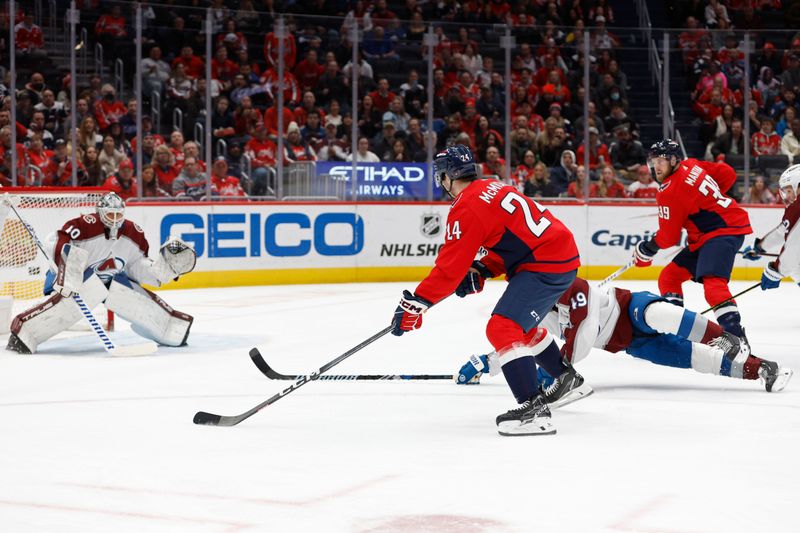 Feb 13, 2024; Washington, District of Columbia, USA; Washington Capitals center Connor McMichael (24) skates in on Colorado Avalanche goaltender Alexandar Georgiev (40) en route to a goal in the first period at Capital One Arena. Mandatory Credit: Geoff Burke-USA TODAY Sports