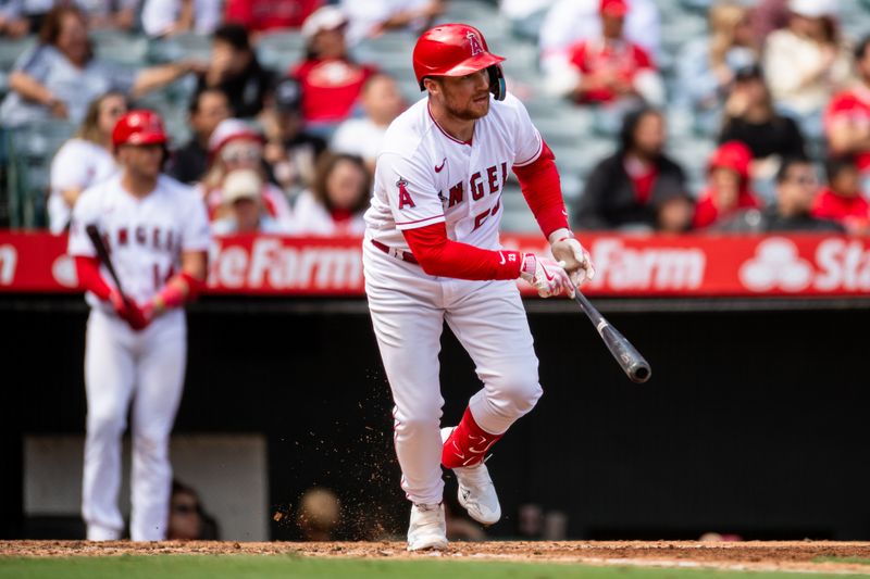 Oct 1, 2023; Anaheim, California, USA; Los Angeles Angels first baseman Brandon Drury (23) doubles against the Oakland Athletics during the fourth inning at Angel Stadium. Mandatory Credit: Jonathan Hui-USA TODAY Sports
