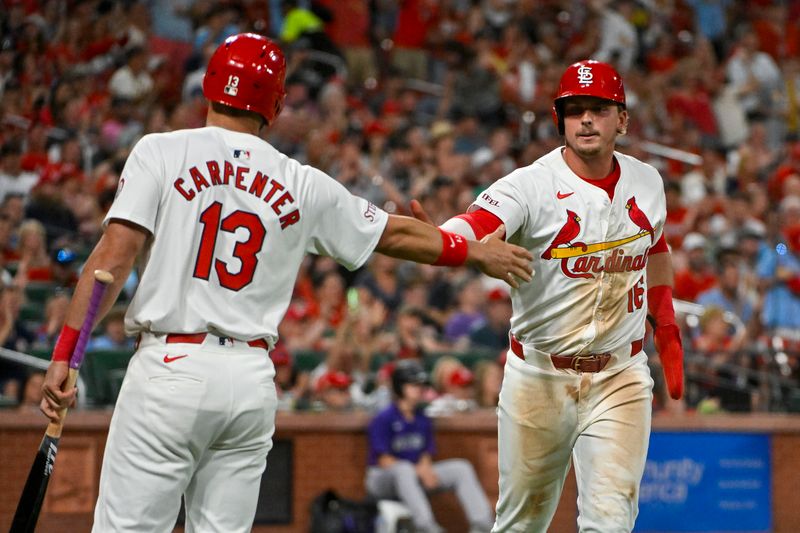 Jun 6, 2024; St. Louis, Missouri, USA;  St. Louis Cardinals second baseman Nolan Gorman (16) is congratulated by designated hitter Matt Carpenter (13) after coring against the Colorado Rockies during the sixth inning at Busch Stadium. Mandatory Credit: Jeff Curry-USA TODAY Sports