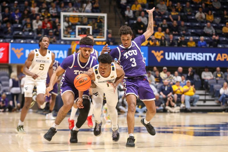 Feb 25, 2025; Morgantown, West Virginia, USA; TCU Horned Frogs forward Micah Robinson (5) and West Virginia Mountaineers guard Joseph Yesufu (1) and TCU Horned Frogs guard Vasean Allette (3) fight for a loose ball during the first half at WVU Coliseum. Mandatory Credit: Ben Queen-Imagn Images