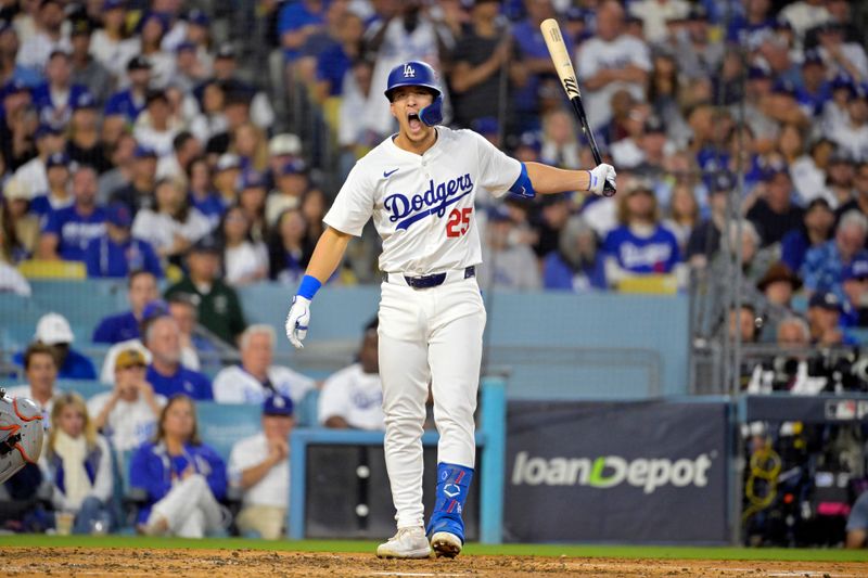 Oct 20, 2024; Los Angeles, California, USA; Los Angeles Dodgers shortstop Tommy Edman (25) reacts after hitting a two run home run in the third inning against the New York Mets during game six of the NLCS for the 2024 MLB playoffs at Dodger Stadium. Mandatory Credit: Jayne Kamin-Oncea-Imagn Images
