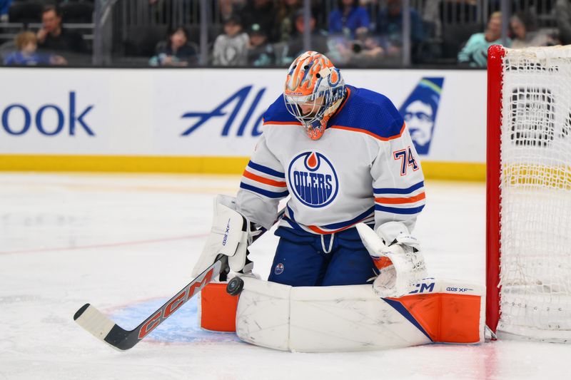 Mar 2, 2024; Seattle, Washington, USA; Edmonton Oilers goaltender Stuart Skinner (74) blocks a goal shot against the Seattle Kraken during the second period at Climate Pledge Arena. Mandatory Credit: Steven Bisig-USA TODAY Sports