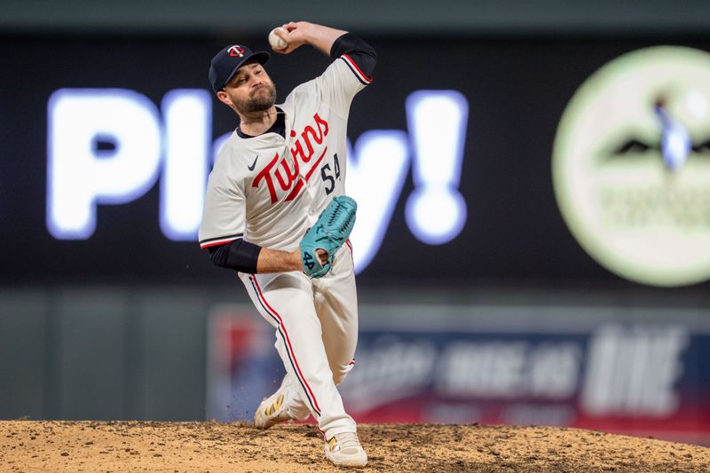 Apr 23, 2025; Minneapolis, Minnesota, USA; Minnesota Twins pitcher Danny Coulombe (54) pitches to Chicago White Sox second base Lenyn Sosa (50) in the ninth inning at Target Field. Mandatory Credit: Matt Blewett-Imagn Images