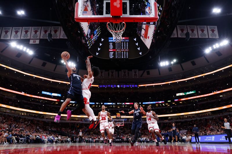 CHICAGO, IL - OCTOBER 30: Jalen Suggs #4 of the Orlando Magic drives to the basket during the game against the Chicago Bulls on October 30, 2024 at United Center in Chicago, Illinois. NOTE TO USER: User expressly acknowledges and agrees that, by downloading and or using this photograph, User is consenting to the terms and conditions of the Getty Images License Agreement. Mandatory Copyright Notice: Copyright 2024 NBAE (Photo by Kamil Krzaczynski/NBAE via Getty Images)