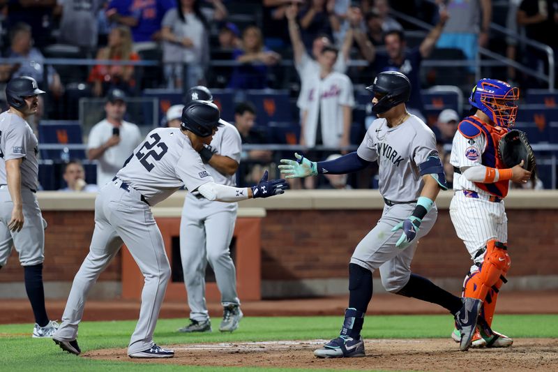 Jun 25, 2024; New York City, New York, USA; New York Yankees center fielder Aaron Judge (99) celebrates his grand slam home run against the New York Mets with right fielder Juan Soto (22) during the eighth inning at Citi Field. Mandatory Credit: Brad Penner-USA TODAY Sports
