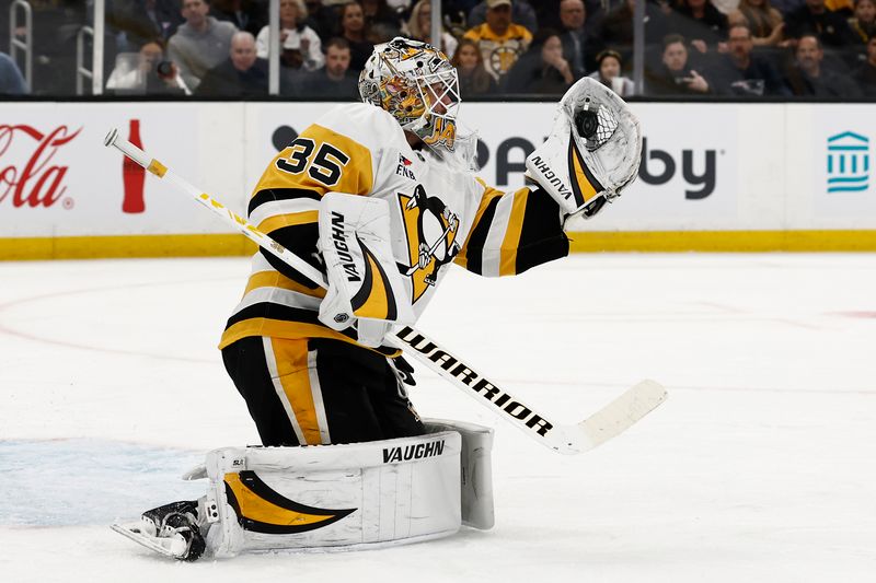 Nov 29, 2024; Boston, Massachusetts, USA; Pittsburgh Penguins goaltender Tristan Jarry (35) makes a glove save against the Boston Bruins during the first period at TD Garden. Mandatory Credit: Winslow Townson-Imagn Images