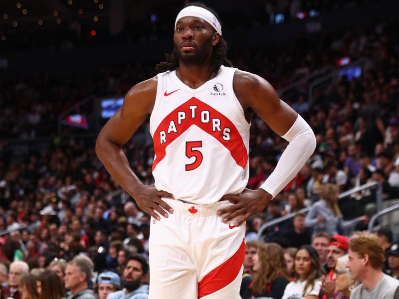 TORONTO, CANADA - OCTOBER 20: Precious Achiuwa #5 of the Toronto Raptors looks on during the game against the Washington Wizards on October 20, 2023 at the Scotiabank Arena in Toronto, Ontario, Canada.  NOTE TO USER: User expressly acknowledges and agrees that, by downloading and or using this Photograph, user is consenting to the terms and conditions of the Getty Images License Agreement.  Mandatory Copyright Notice: Copyright 2023 NBAE (Photo by Vaughn Ridley/NBAE via Getty Images)