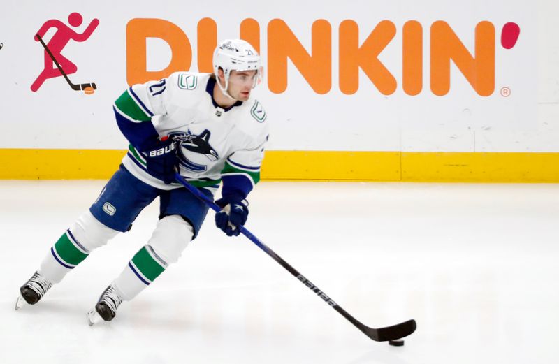 Jan 11, 2024; Pittsburgh, Pennsylvania, USA; Vancouver Canucks left wing Nils Hoglander (21) warms up before the game against the Pittsburgh Penguins at PPG Paints Arena. Mandatory Credit: Charles LeClaire-USA TODAY Sports