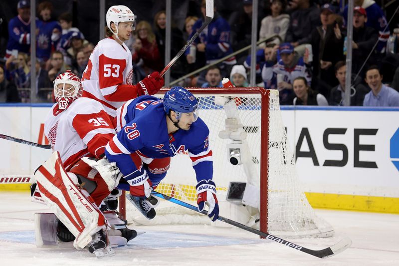 Nov 29, 2023; New York, New York, USA; New York Rangers left wing Chris Kreider (20) falls over Detroit Red Wings goaltender Ville Husso (35) during the first period at Madison Square Garden. Mandatory Credit: Brad Penner-USA TODAY Sports