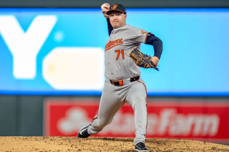 Sep 27, 2024; Minneapolis, Minnesota, USA; Baltimore Orioles pitcher Jacob Webb (71) pitches to Minnesota Twins first baseman Carlos Santana (30) in the seventh inning at Target Field. Mandatory Credit: Matt Blewett-Imagn Images