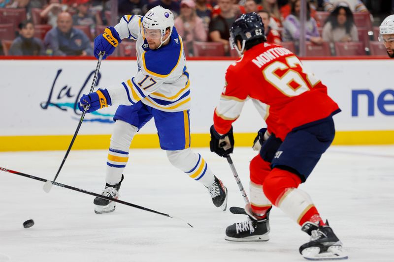 Apr 4, 2023; Sunrise, Florida, USA; Buffalo Sabres center Tyson Jost (17) shoots the puck as Florida Panthers defenseman Brandon Montour (62) defends during the first period at FLA Live Arena. Mandatory Credit: Sam Navarro-USA TODAY Sports