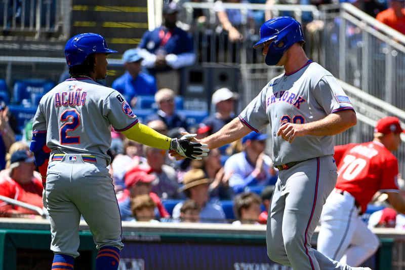 Apr 27, 2025; Washington, District of Columbia, USA; New York Mets first baseman Pete Alonso (20) is congratulated by second baseman Luisangel Acuna (2) after scoring against the Washington Nationals during the first inning at Nationals Park. Mandatory Credit: Brad Mills-Imagn Images