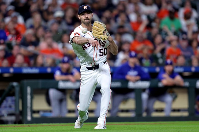 Jul 13, 2024; Houston, Texas, USA; Houston Astros relief pitcher Tayler Scott (50) throws a fielded ball to first base for an out against the Texas Rangers during the ninth inning at Minute Maid Park. Mandatory Credit: Erik Williams-USA TODAY Sports