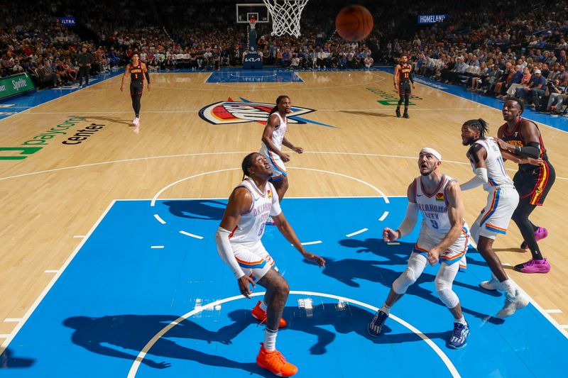 OKLAHOMA CITY, OK - OCTOBER 27: Jalen Williams #8 and Alex Caruso #9 of the Oklahoma City Thunder wait for a rebound during the game  on October 27, 2024 at Paycom Center in Oklahoma City, Oklahoma. NOTE TO USER: User expressly acknowledges and agrees that, by downloading and or using this photograph, User is consenting to the terms and conditions of the Getty Images License Agreement. Mandatory Copyright Notice: Copyright 2024 NBAE (Photo by Zach Beeker/NBAE via Getty Images)