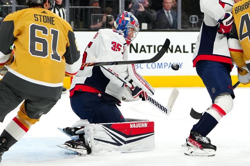 Dec 2, 2023; Las Vegas, Nevada, USA; Washington Capitals goaltender Darcy Kuemper (35) makes a save against the Vegas Golden Knights during the second period at T-Mobile Arena. Mandatory Credit: Stephen R. Sylvanie-USA TODAY Sports