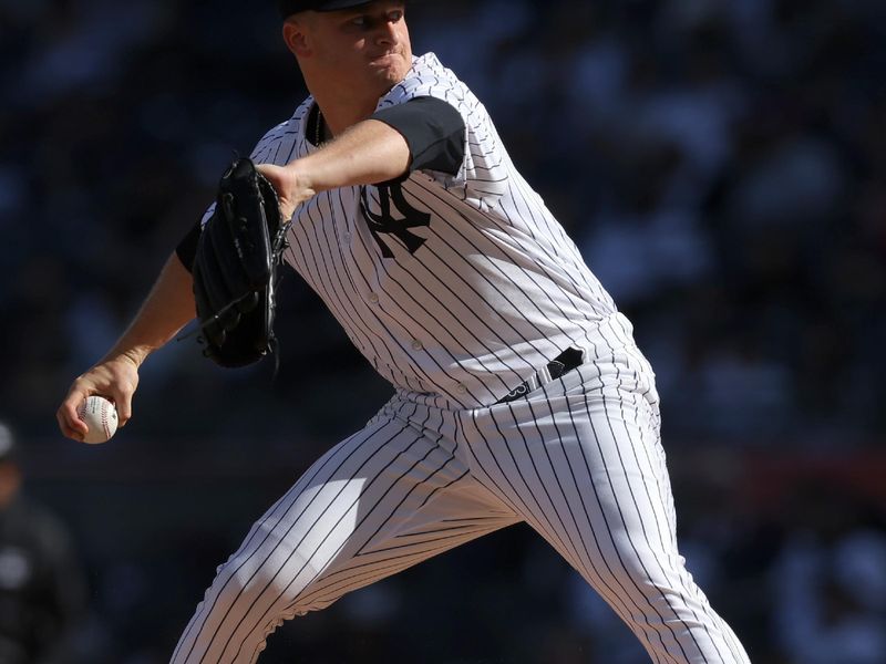 Apr 1, 2023; Bronx, New York, USA; New York Yankees starting pitcher Clarke Schmidt (36) pitches against the San Francisco Giants during the first inning at Yankee Stadium. Mandatory Credit: Brad Penner-USA TODAY Sports